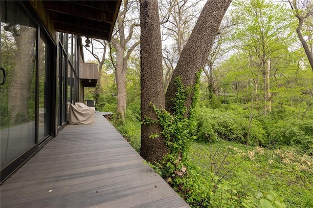 wooden deck featuring a wooded view