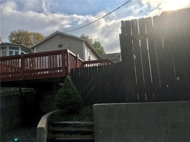 view of side of home with a wooden deck