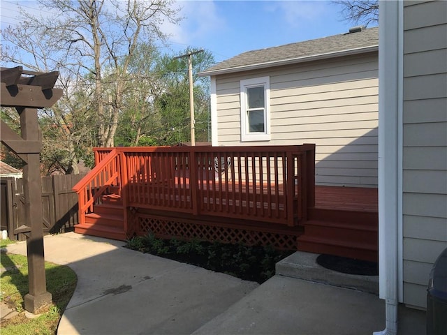 wooden deck featuring fence