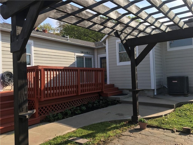 wooden deck with a pergola and central AC