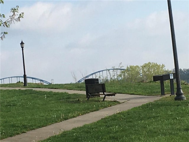 view of home's community with a lawn