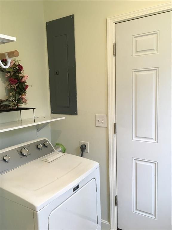 clothes washing area featuring washer / clothes dryer, laundry area, and electric panel