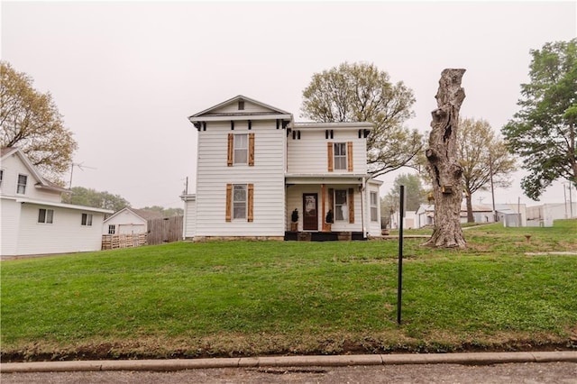 view of front facade with a porch and a front lawn