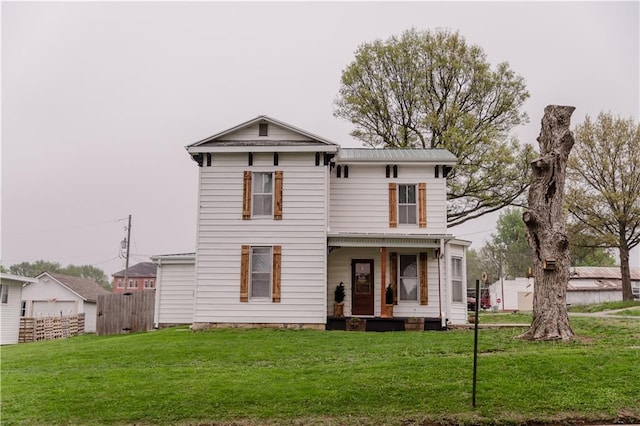 italianate-style house with fence and a front yard