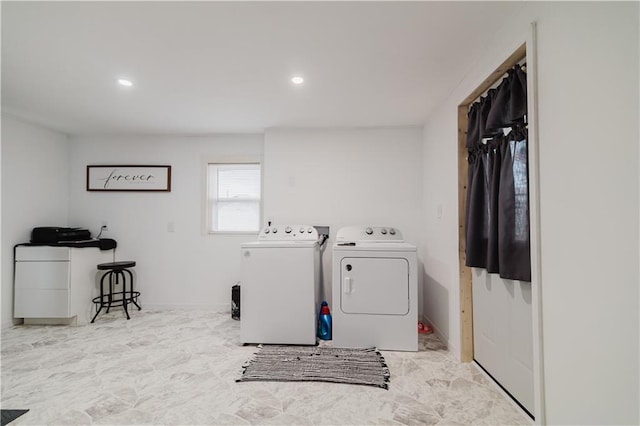 washroom featuring washing machine and clothes dryer, recessed lighting, laundry area, and baseboards