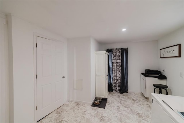 interior space featuring recessed lighting and baseboards