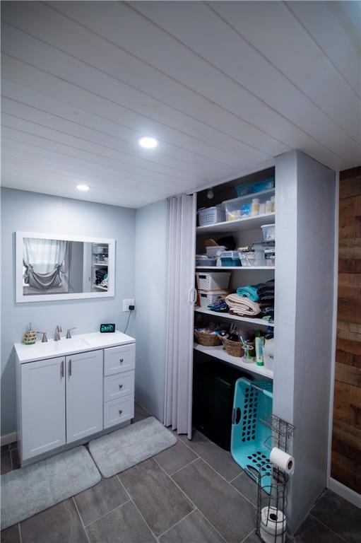 interior space with recessed lighting and a sink