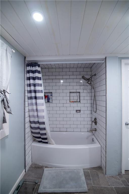 bathroom with shower / tub combo with curtain