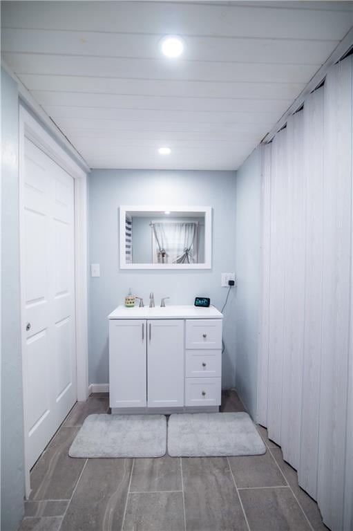 bathroom with vanity and recessed lighting