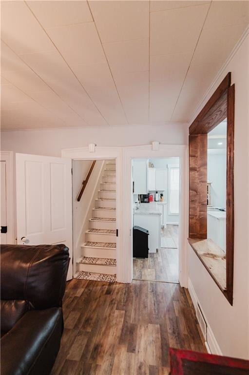 living room with dark wood-style floors and stairway