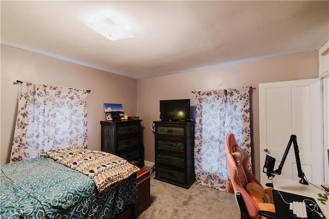 bedroom featuring light carpet
