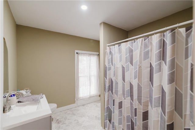 bathroom featuring vanity, toilet, a shower with shower curtain, marble finish floor, and recessed lighting