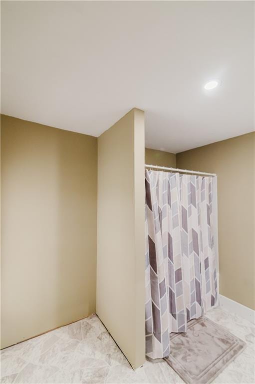bathroom featuring recessed lighting and a shower with shower curtain