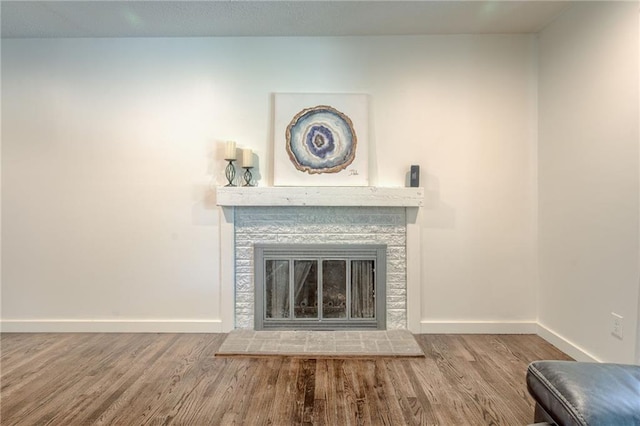 7636 Windsor St, Prairie Village, KS 66208 - living area with wood finished floors, baseboards, and a glass covered fireplace