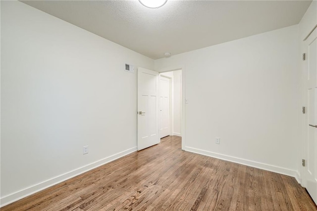 7636 Windsor St, Prairie Village, KS 66208 - unfurnished bedroom featuring wood finished floors and baseboards