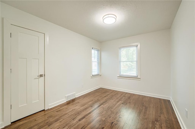 7636 Windsor St, Prairie Village, KS 66208 - spare room with wood finished floors and baseboards