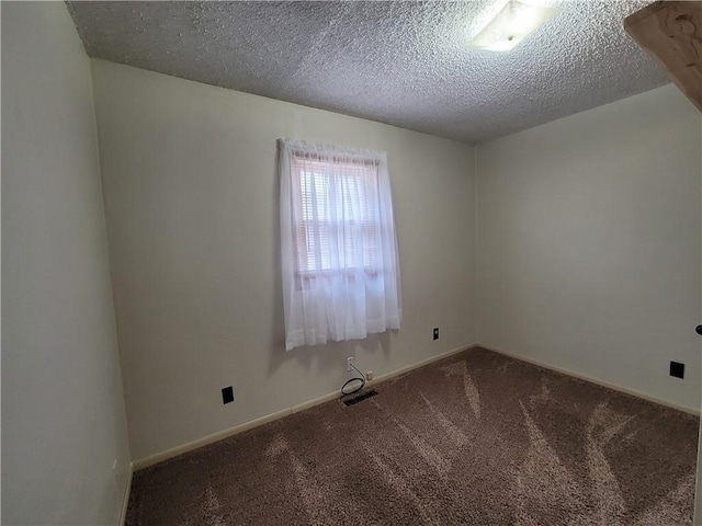 601 S 24th St, Lexington, MO 64067 - carpeted spare room featuring baseboards, visible vents, and a textured ceiling