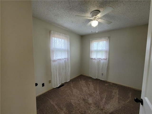601 S 24th St, Lexington, MO 64067 - carpeted empty room with a ceiling fan, a wealth of natural light, a textured ceiling, and baseboards