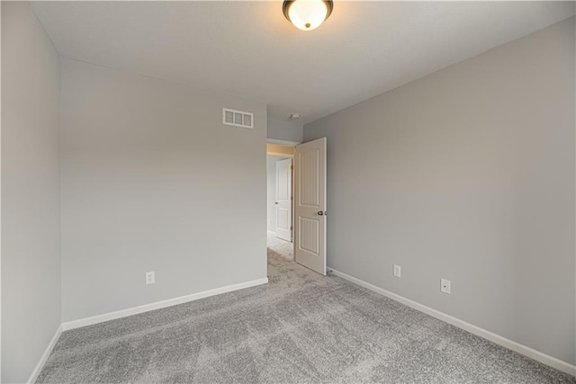 11802 N Bellaire Ave, Kansas City, MO 64156 - carpeted spare room featuring baseboards