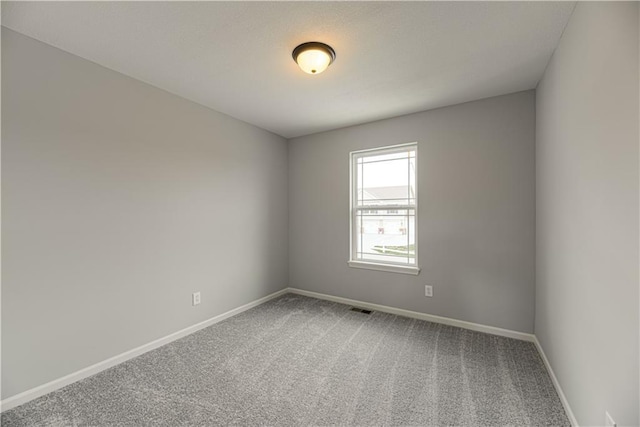 11802 N Bellaire Ave, Kansas City, MO 64156 - spare room with carpet floors and baseboards