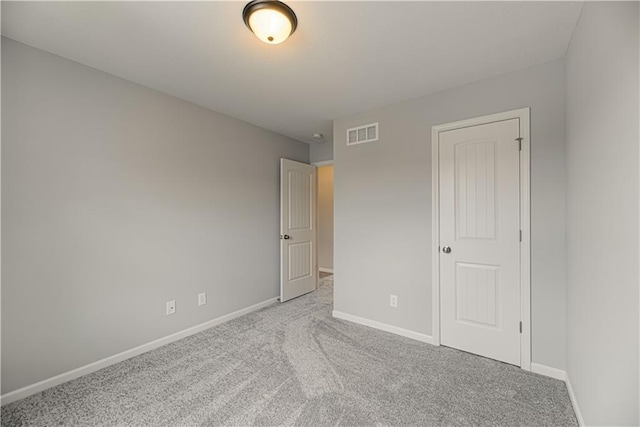 11802 N Bellaire Ave, Kansas City, MO 64156 - unfurnished bedroom with carpet flooring and baseboards