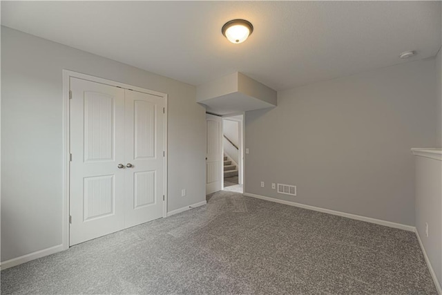 11802 N Bellaire Ave, Kansas City, MO 64156 - unfurnished bedroom with carpet flooring, baseboards, and a closet