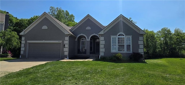 9201 N Harrison St, Kansas City, MO 64155 - single story home featuring driveway, a front lawn, an attached garage, and stucco siding