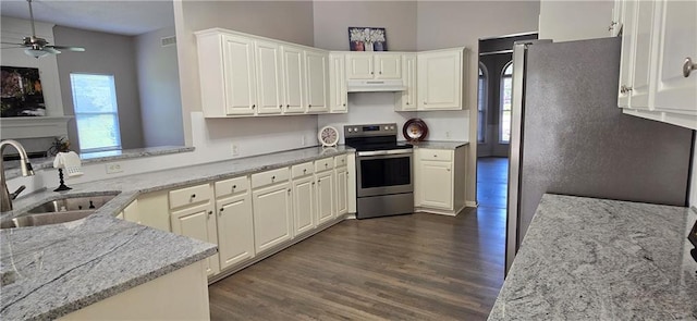 9201 N Harrison St, Kansas City, MO 64155 - kitchen with appliances with stainless steel finishes, a sink, under cabinet range hood, dark wood-style flooring, and ceiling fan