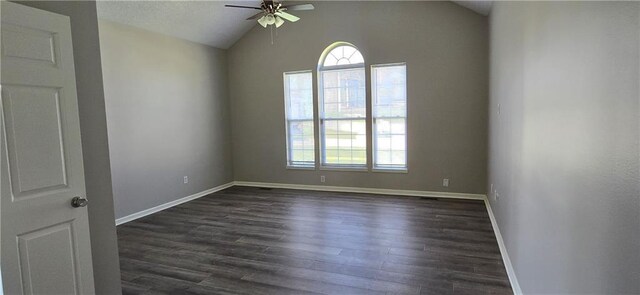 9201 N Harrison St, Kansas City, MO 64155 - empty room featuring ceiling fan, lofted ceiling, dark wood-type flooring, and baseboards