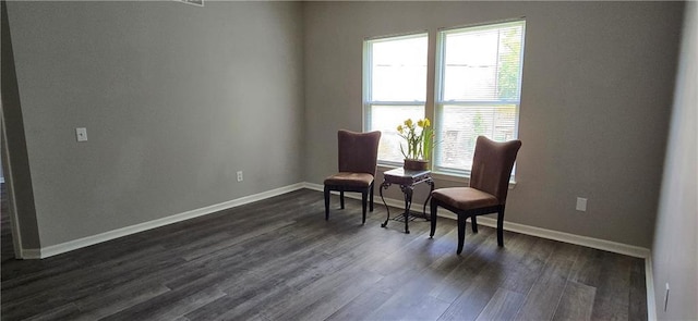 9201 N Harrison St, Kansas City, MO 64155 - sitting room featuring plenty of natural light, dark wood-style floors, and baseboards
