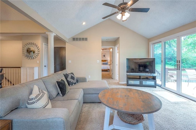 living room with light carpet, ceiling fan, lofted ceiling, baseboards, and decorative columns