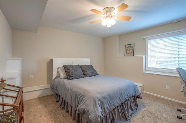 bedroom featuring carpet flooring, baseboards, and ceiling fan