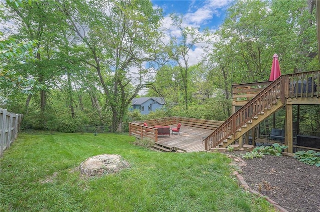 view of yard with a deck and stairway