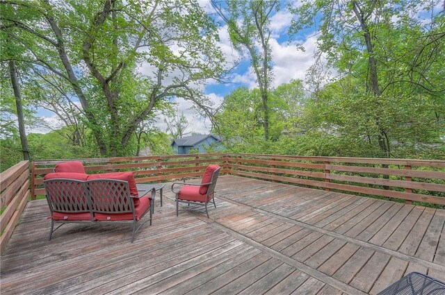 wooden terrace with outdoor lounge area