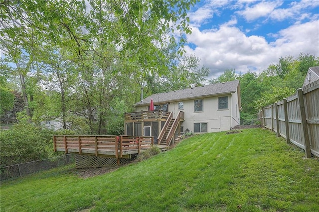 rear view of property with a deck and stairway