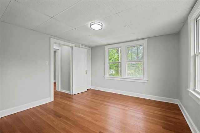 interior space featuring baseboards and wood finished floors