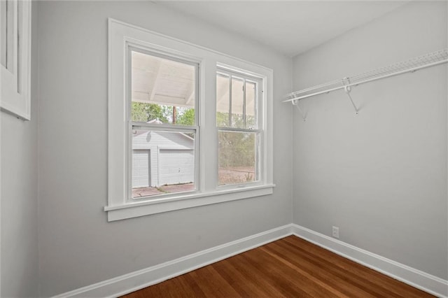 walk in closet featuring dark wood-type flooring
