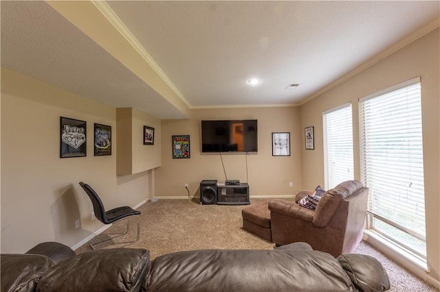 carpeted living area with baseboards, plenty of natural light, ornamental molding, and visible vents