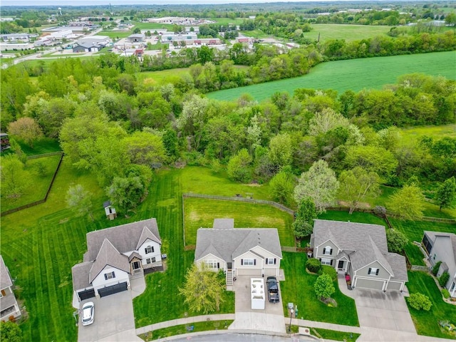 birds eye view of property with a residential view
