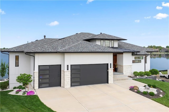 view of front of property with an attached garage, stucco siding, stone siding, and concrete driveway
