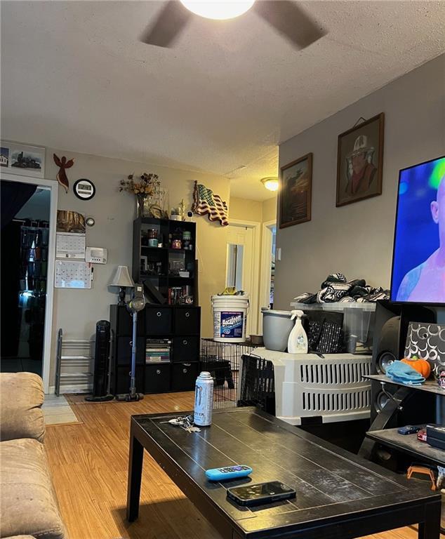 1114 Dakota St, Leavenworth, KS 66048 - living area featuring wood finished floors and ceiling fan