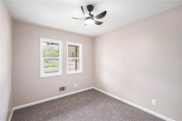 9505 E 79th St, Raytown, MO 64138 - carpeted spare room featuring visible vents, a ceiling fan, and baseboards