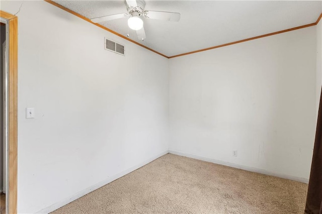 unfurnished room featuring visible vents, ceiling fan, ornamental molding, and carpet floors