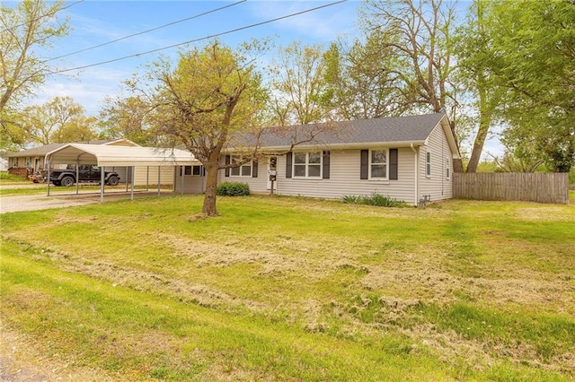 single story home with fence, a carport, driveway, and a front yard