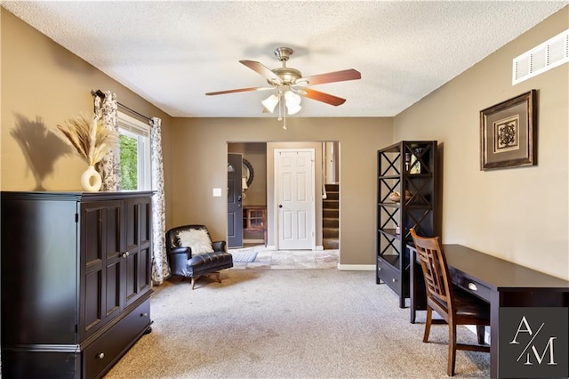 1708 NW Ashton Dr, Blue Springs, MO 64015 - office space with visible vents, light carpet, baseboards, ceiling fan, and a textured ceiling