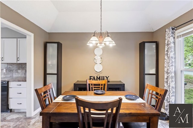 1708 NW Ashton Dr, Blue Springs, MO 64015 - dining space featuring an inviting chandelier and lofted ceiling