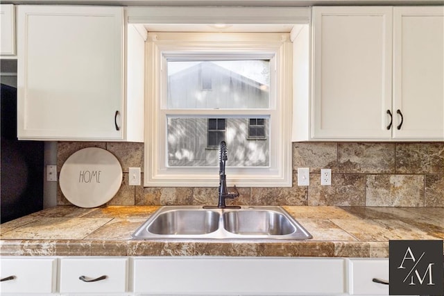 1708 NW Ashton Dr, Blue Springs, MO 64015 - kitchen featuring a sink, white cabinetry, and tile countertops
