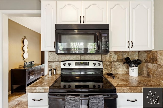 1708 NW Ashton Dr, Blue Springs, MO 64015 - kitchen featuring electric range, white cabinets, black microwave, and tasteful backsplash