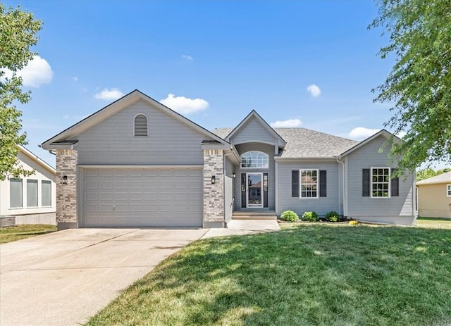 709 SW Graystone Dr, Grain Valley, MO 64029 - ranch-style house with a garage, driveway, and a front lawn