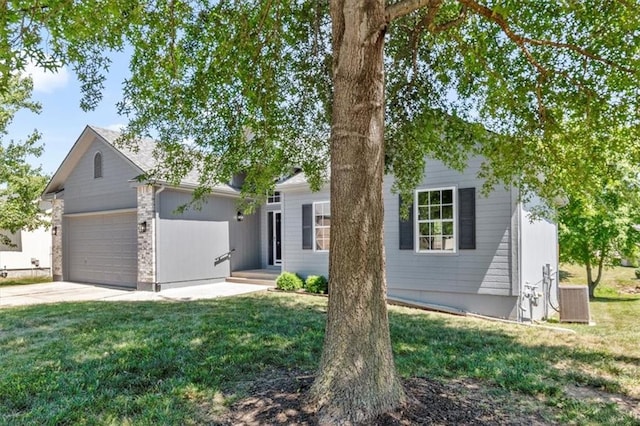 709 SW Graystone Dr, Grain Valley, MO 64029 - view of front facade featuring an attached garage, a front lawn, and driveway